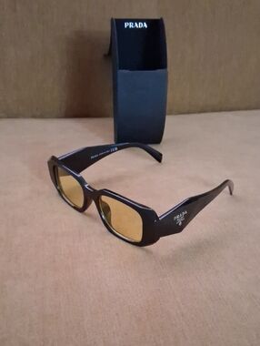 Prada Black Frame Sunglasses with Amber Lenses